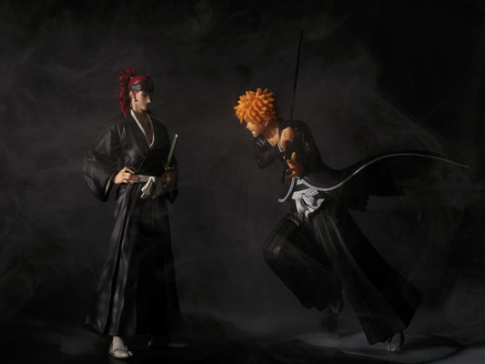 Ichigo faces off against renji in a dramatic pose.